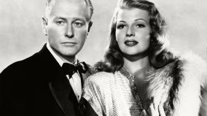 George Macready en compagnie de la belle Rita Hayworth dans le film de 1946.